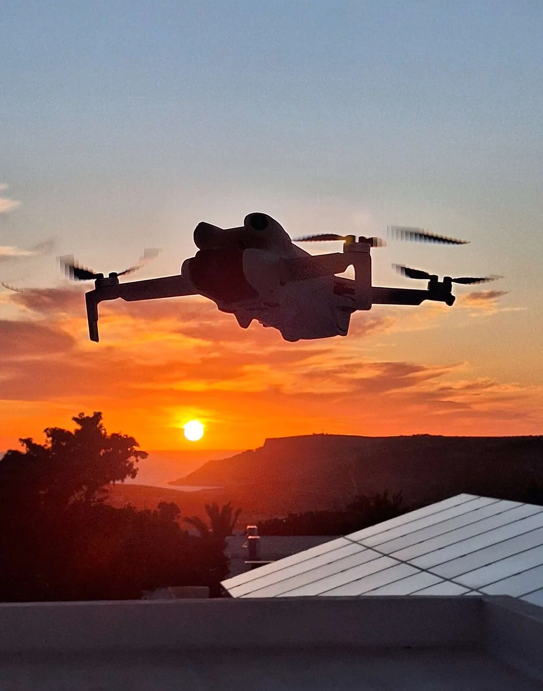 Drone flying at sunset